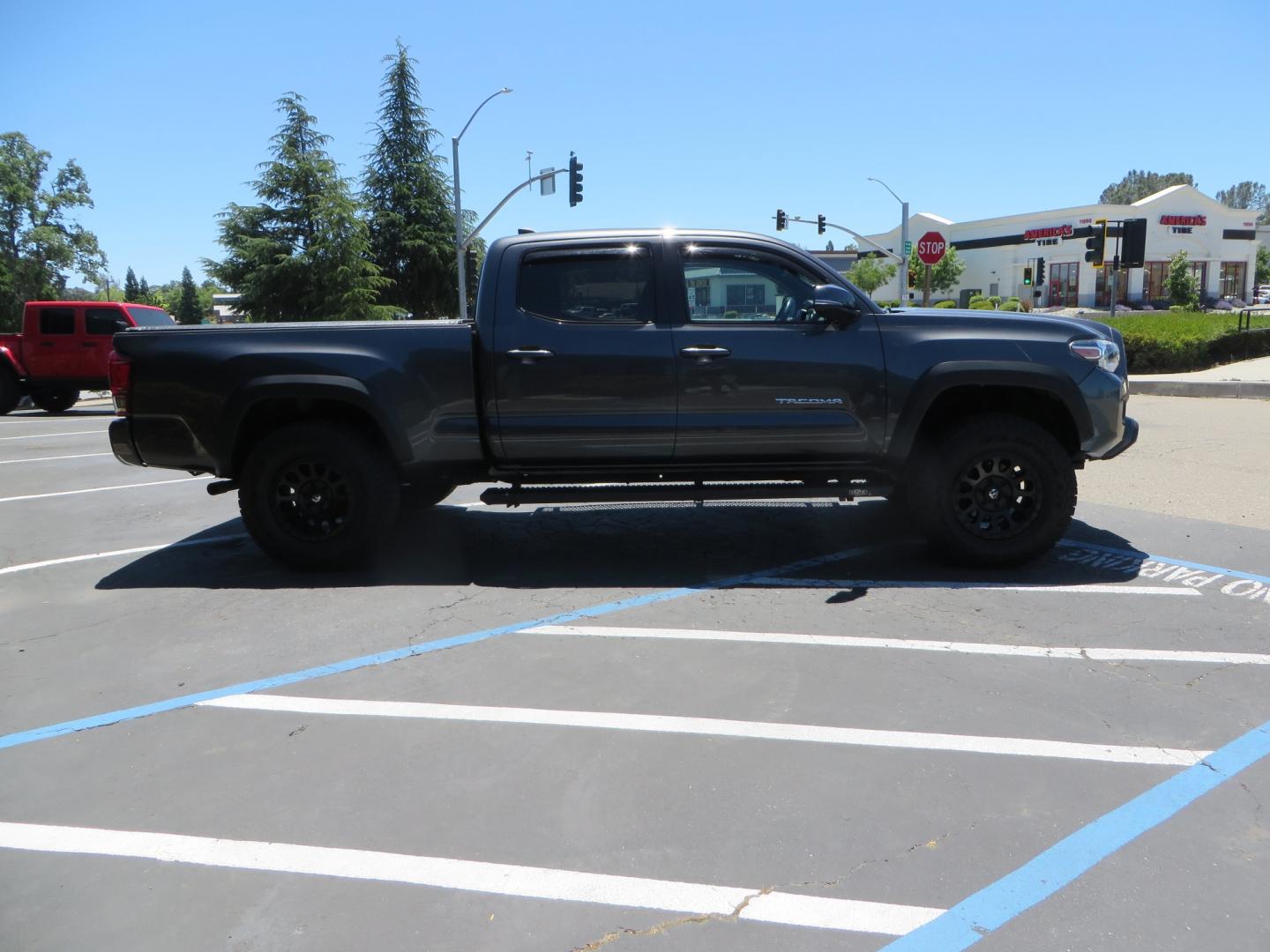 2017 CHARCOAL /GREY Toyota Tacoma TRD OFF-ROAD Double Cab Long Bed V6 6AT 4WD (3TMDZ5BN3HM) with an 3.5L V6 engine, automatic transmission, located at 2630 Grass Valley Highway, Auburn, CA, 95603, (530) 508-5100, 38.937893, -121.095482 - TRD Off-road Tacoma with a level kit, 17" Fuel Vector wheels, Falken Wildpeak AT tires, N-Fab running boards, Roll Up tonneau cover, BedRug, and window Deflectors. - Photo#3